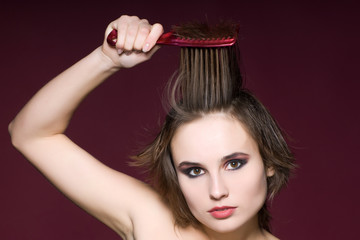 Closeup woman with hairbrush