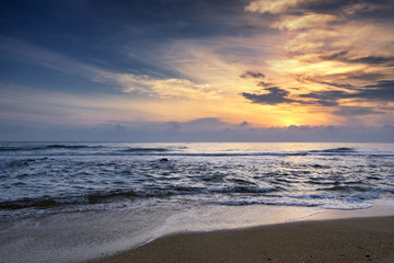 Fototapeta na wymiar Amazing nature seascape background with beautiful color of sunrise, Soft focus due to long exposure.