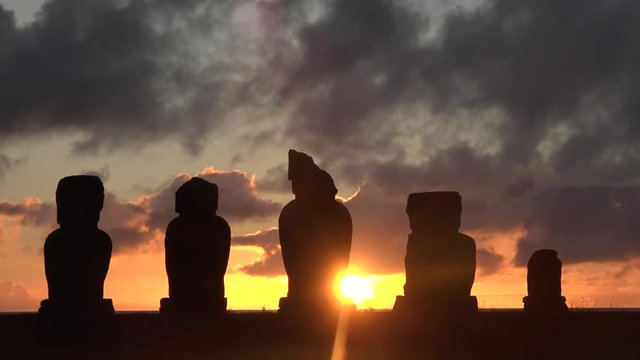 A fantastic sunset at the statues of Moai on Easter Island (Rapa Nui).