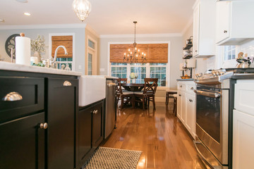 Spacious Modern Kitchen with Dark Cabinets Wood Floors Marble Island 