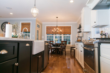 Spacious Modern Kitchen with Dark Cabinets Wood Floors Marble Island 
