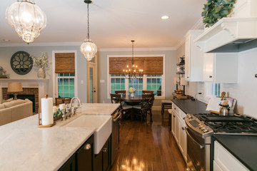 Spacious Modern Kitchen with Dark Cabinets Wood Floors Marble Island 