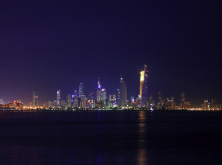 Naklejka premium The Skyline Of Kuwait City At Night Glitters With Light