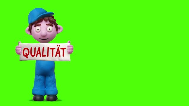 Sprechender Handwerker aus Knete mit Schild &bdquo;Qualit&auml;t&ldquo;