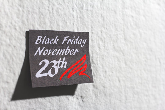 Black friday shopping sale. Post it reminder on wall.