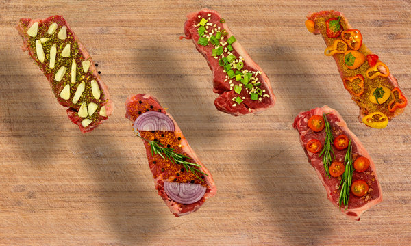 Conceptual floating view of vegetable seasoned New York Strips