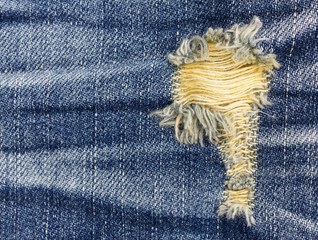 Jeans background. texture torn denim