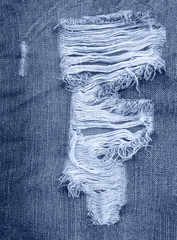 Jeans background. texture torn denim