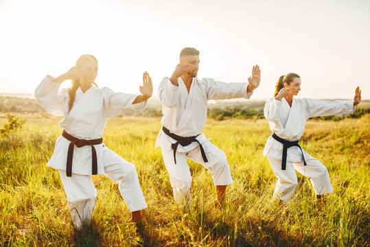 Female karate training skill with instructor