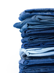 jeans stacked on white background blank for design and text input.