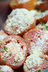 tomato bake with cheese in dish background.