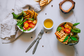Cherry tomato salad with grilled haloumi cheese, with chard and arugula
