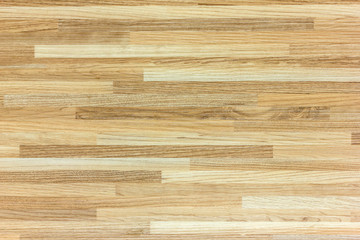Hardwood maple basketball court floor viewed from above.