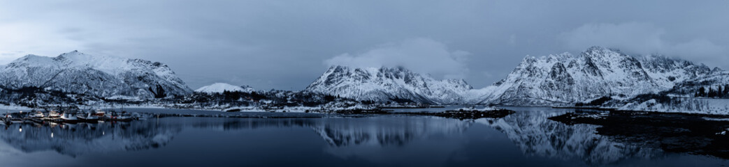 Landscape with beautiful winter lake and snowy mountains at Lofoten Islands in Northern Norway. Panoramic view