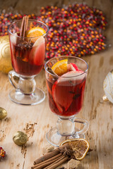 Mulled wine with nuts and spices. Selective focus.