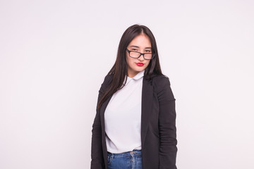 Portrait of beautiful young asian woman with red lips dressed in black jacket over white background with copy space