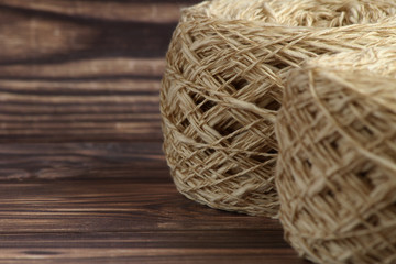 Two knit balls of yarn for  handmade knitting clothes on a dark background
