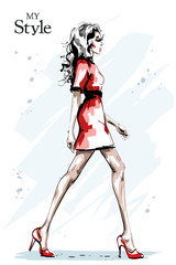 Obraz na płótnie Canvas Hand drawn beautiful young woman with long hair. Stylish elegant girl in red dress. Fashion woman full body portrait. Sketch.