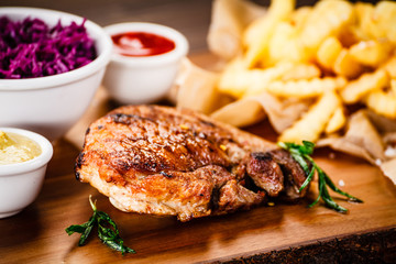 Grilled steak with french fries and vegetables