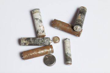 Used finger-wound batteries covered with corrosion. Recycling.