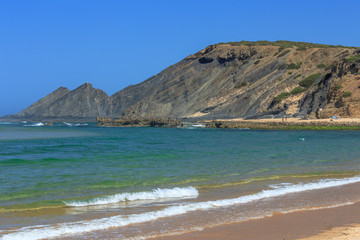 Mountain shaped as a lying man on the beach Praia Amoreira near Aljezur on the west coast of Portugal