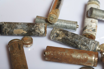 The fulfilled batteries of the different size covered with corrosion. Recycling.