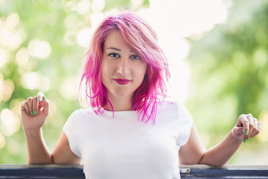 Pink haired young woman portrait
