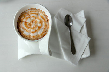 cup of coffee on wooden background