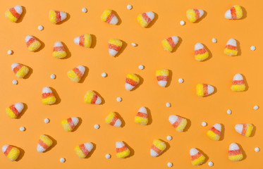 Halloween theme with candies on a orange background