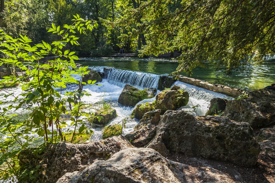 Munich, Germany, on August 22, 2018. Park with stream and artificial wave