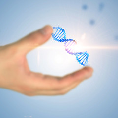 Man hand holding dna helix over blue