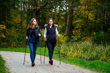 Nordic walking - active people working out in park