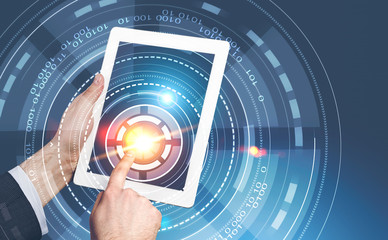 Businessman with tablet touching hud interface