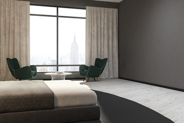 Gray bedroom corner, green armchairs