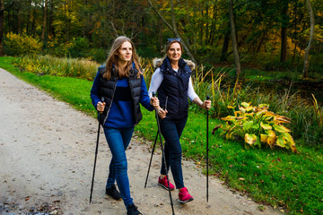 Nordic walking - active people working out in park