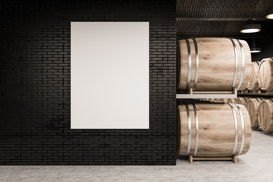 Black brick wine cellar, rows of kegs