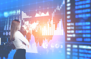 Businesswoman looking at world stats interface