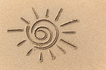 Drawing of the sun on the sand