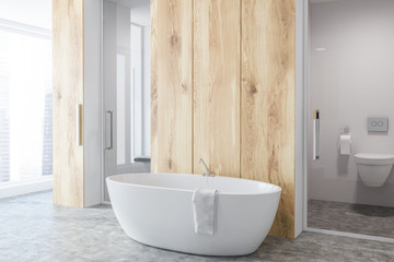 Naklejka na ściany i meble Light wooden bathroom corner, white tub