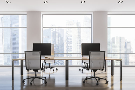 White loft office interior, computer monitors