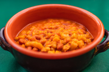 Homemade bread gnocchi with pomodoro and red beans sauce (Traditional dish of Umbria)