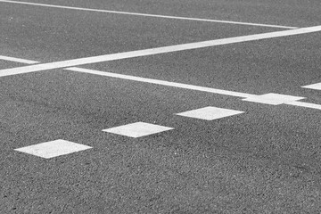 Fototapeta premium Asphalt road crosswalk with marking lines white and yellow stripes
