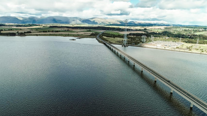 Obraz premium Aerial image of traffic crossing Clackmannanshire Bridge over the River Forth.