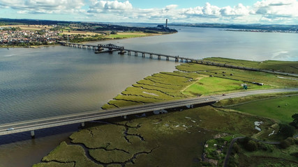 Aerial image of traffic crossing Clackmannanshire Bridge and Kincardine Bridge over the River Forth.