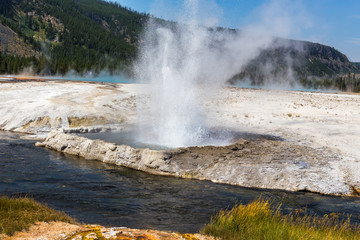 Ejecting fountain of hot water geyser, Yellowstone National Park, USA