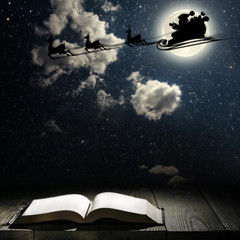 a book against a moonlight night city