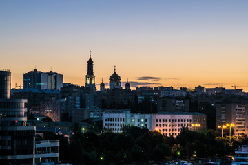 Fototapeta na wymiar night city view with high-rise buildings and Church