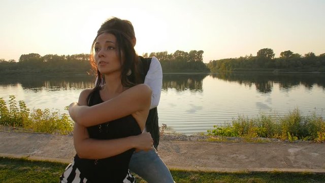 Concept of love and relationships Couple dancing bachata at sunset