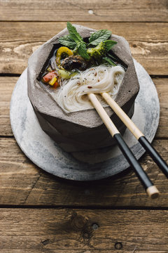 Bowl of Asian Noodle Soup with chopsticks