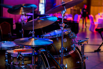Naklejka na ściany i meble Drums stand in a restaurant blurred background